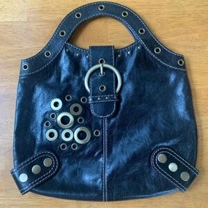 Guess Black Leather Boho Chic Handbag, Gold steel rings holes, Size Medium.